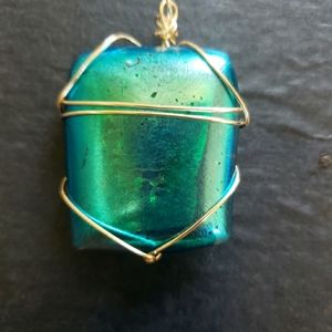 Unique blue greenish dichroic glass pendant.
